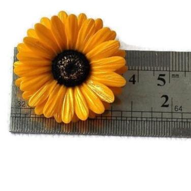 Golden Glow: Gerbera Pin Polymer Clay. 